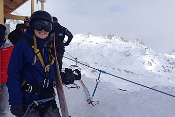 a woman nervously waiting to do a ski jump