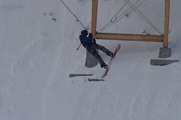 a woman bouncing on a bugee cable