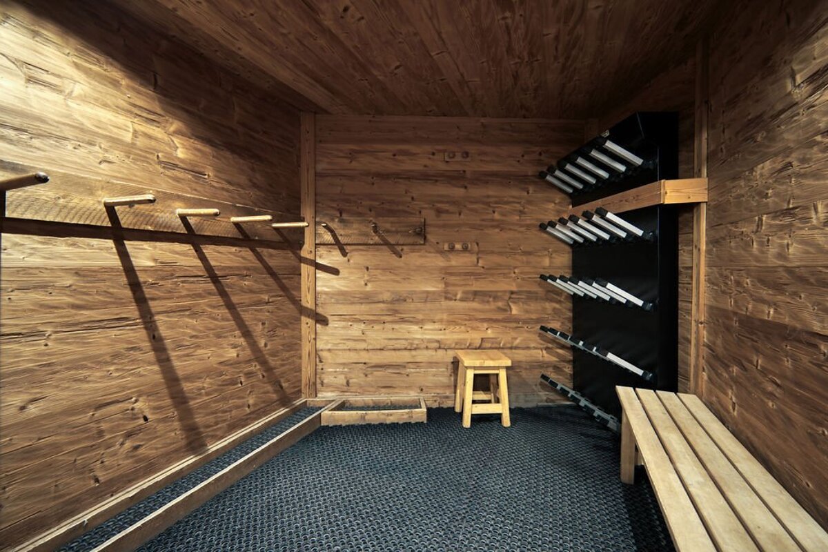 A room with wooden walls and a stool