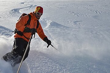 Man skiing powder