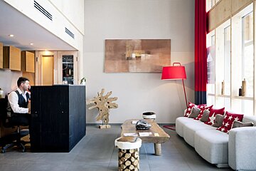 A man sitting at a counter in a living room