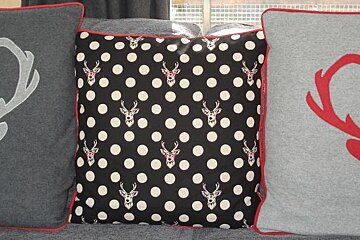 black white and red cushions on a sofa
