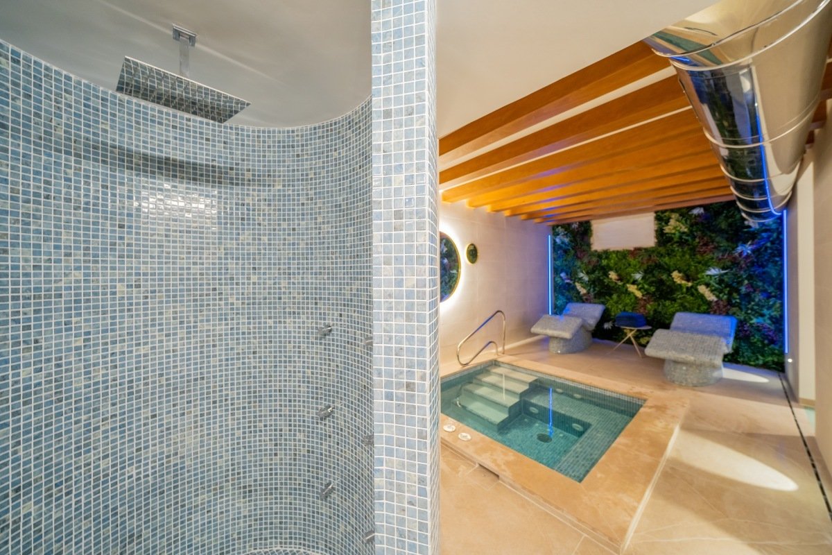 A bathroom with a shower and a swimming pool