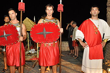 three men dressed as roman soldiers