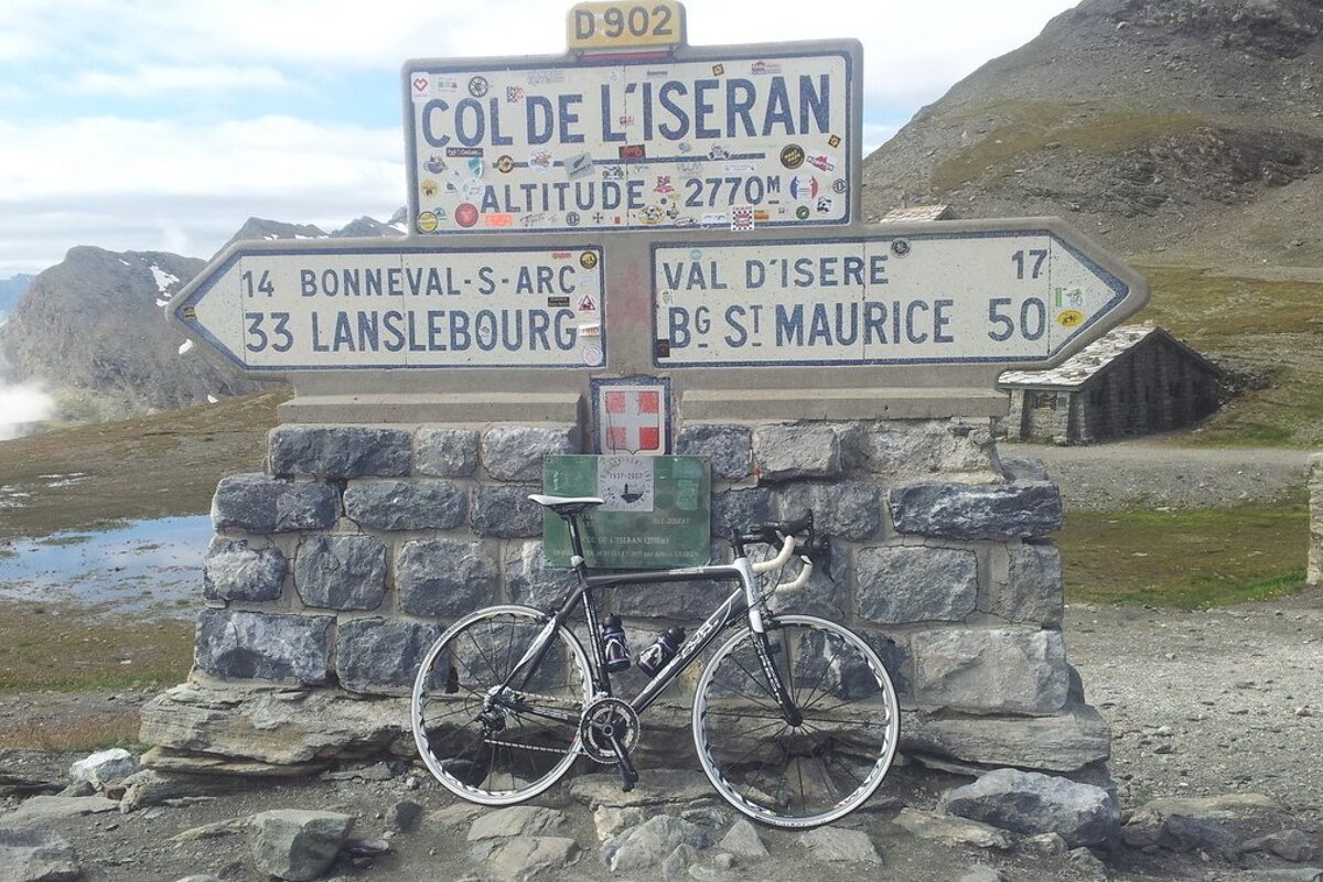 a bike resting by a sign near val disere