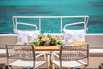 A table with a vase of flowers on it