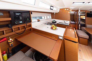 The inside of a boat with a table and a radio