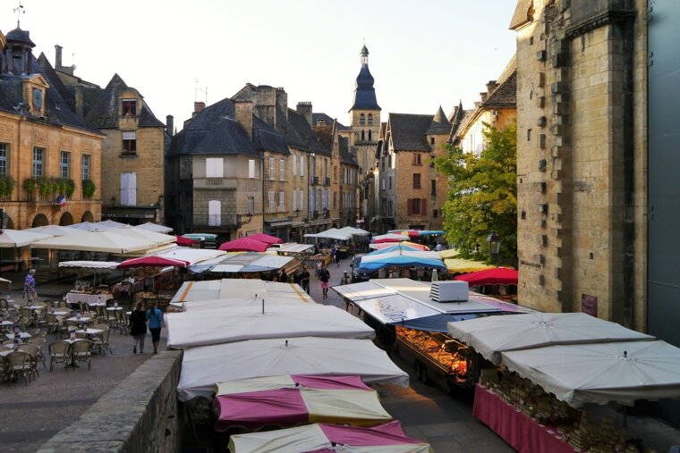 the stalls of the saturday market in sarlat