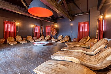 A room filled with wooden chairs and a bowl of rocks