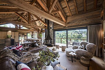 A living room filled with furniture and a fireplace