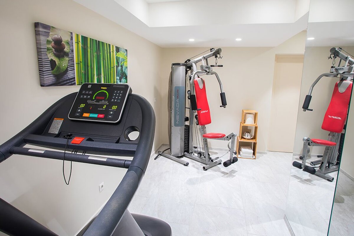 A treadmill in a gym that says ' nordictrack ' on it