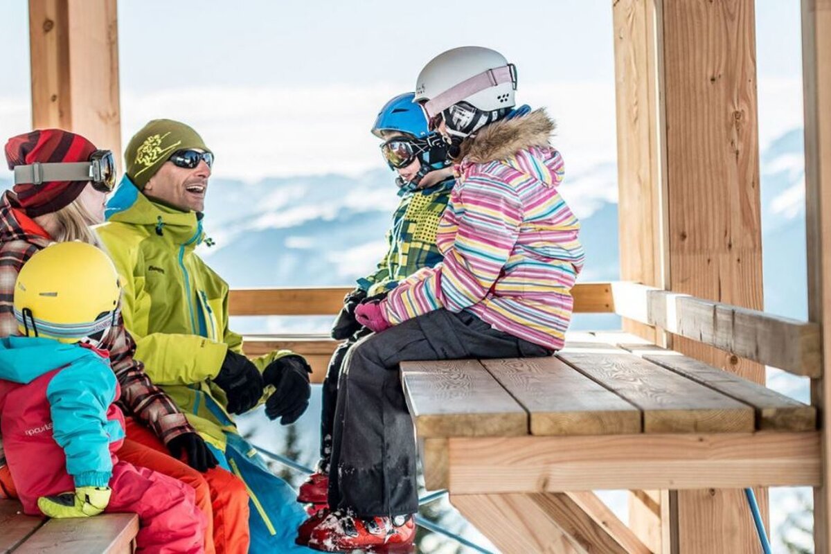 a family on a wooden shelter