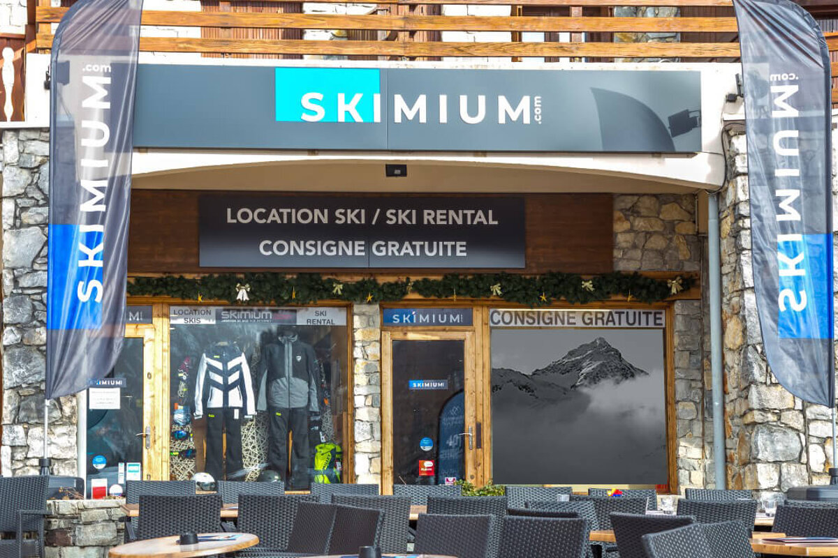 A ski rental store with a sign that says 