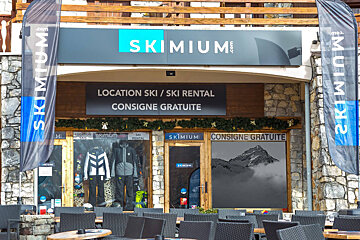 A ski rental store with a sign that says 