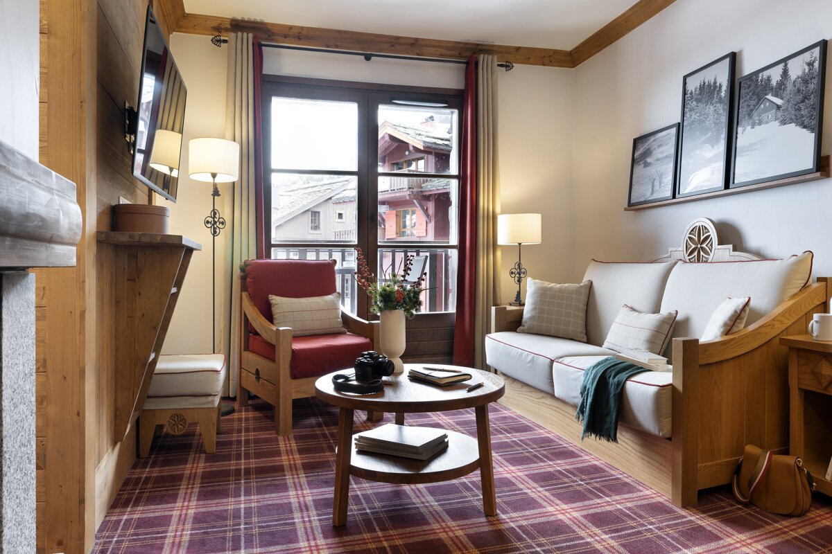 A living room with a couch and a chair
