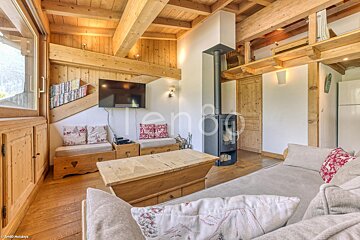 A living room with a couch and a flat screen tv
