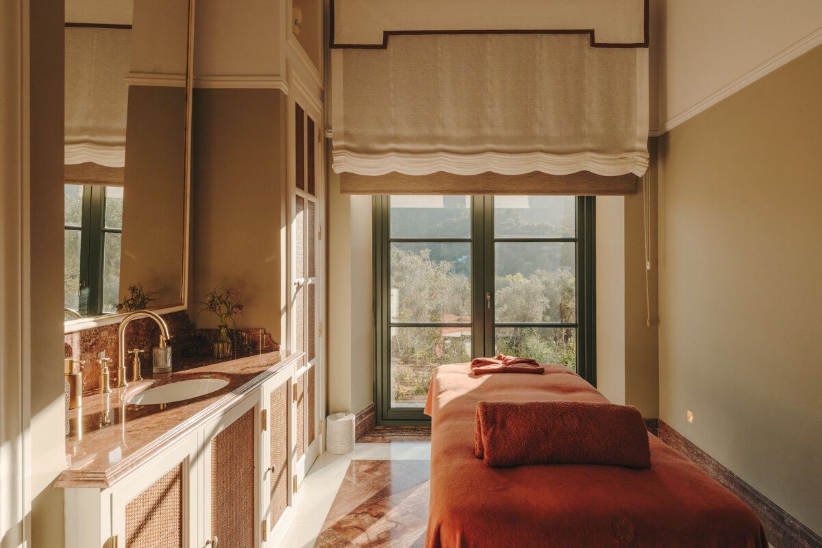 A bathroom with a sink and a massage table