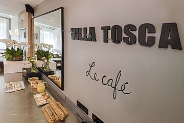 A restaurant with a sign that says villa tosca