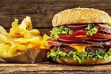 Stacked burger with fries at Home Burgers in Les Gets