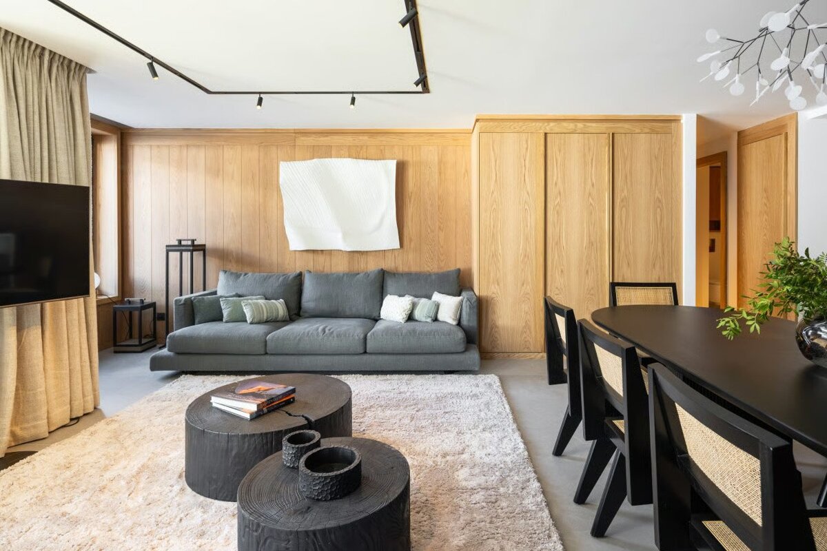 A living room with a couch and a table