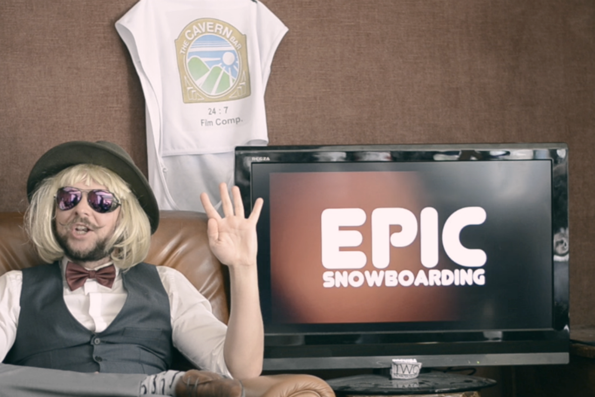 a man in a blonde wig sat on a sofa