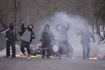 5 men waving axes and chains