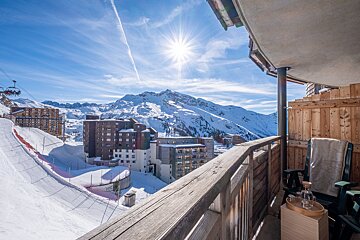 A view of a ski resort from a balcony