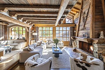 A living room filled with furniture and a fireplace