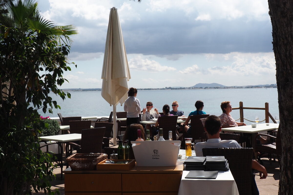 people dining at a restaurant in mallorca