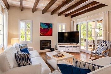 A living room with a couch and a flat screen tv