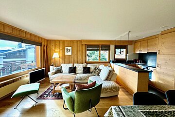 A living room with a couch and a chair