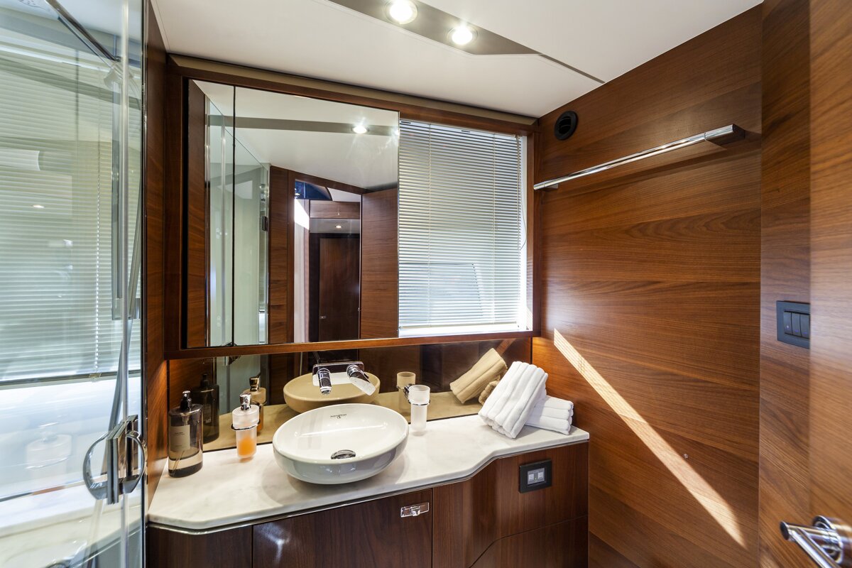 A bathroom with two sinks and a large mirror