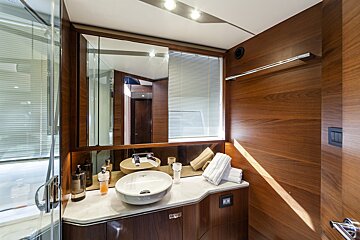 A bathroom with two sinks and a large mirror