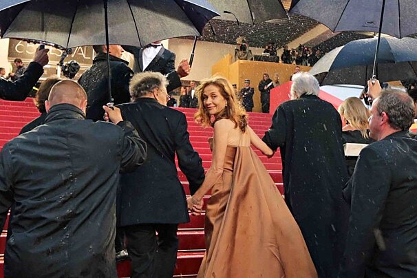 Isabelle Huppert on the red carpet in the rain 2012