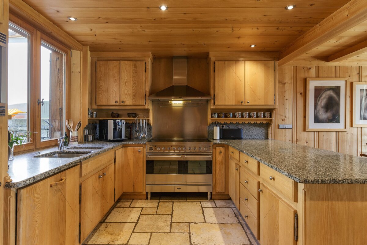 A kitchen with stainless steel appliances and granite counter tops