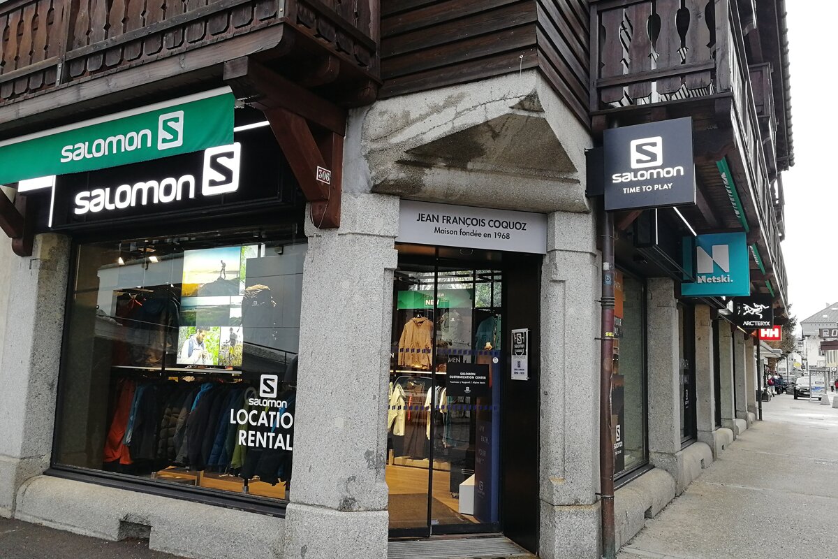 A salomon store is on the corner of a building