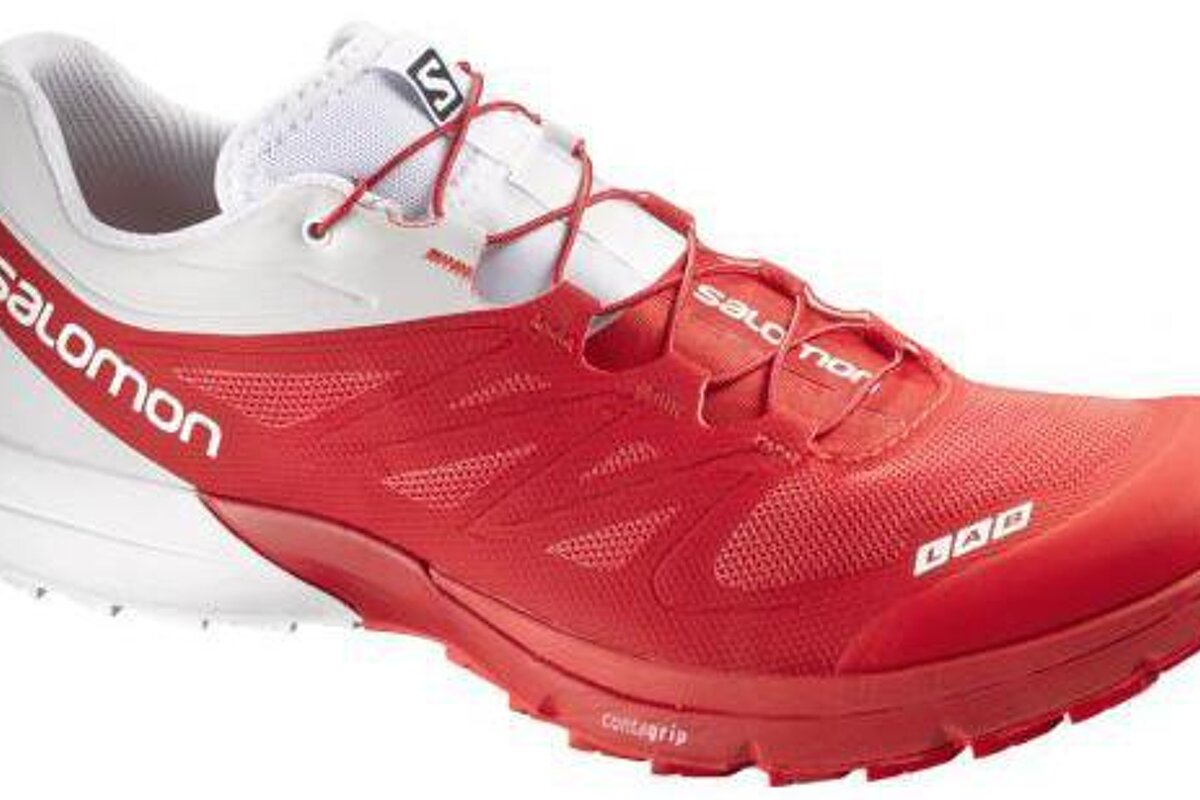 red and white running shoes