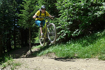 a mountain biker jumping