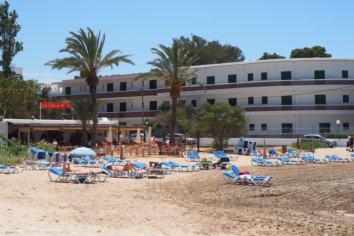 A beach with sun loungers near to san antonio ibiza