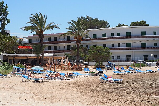 A beach with sun loungers near to san antonio ibiza