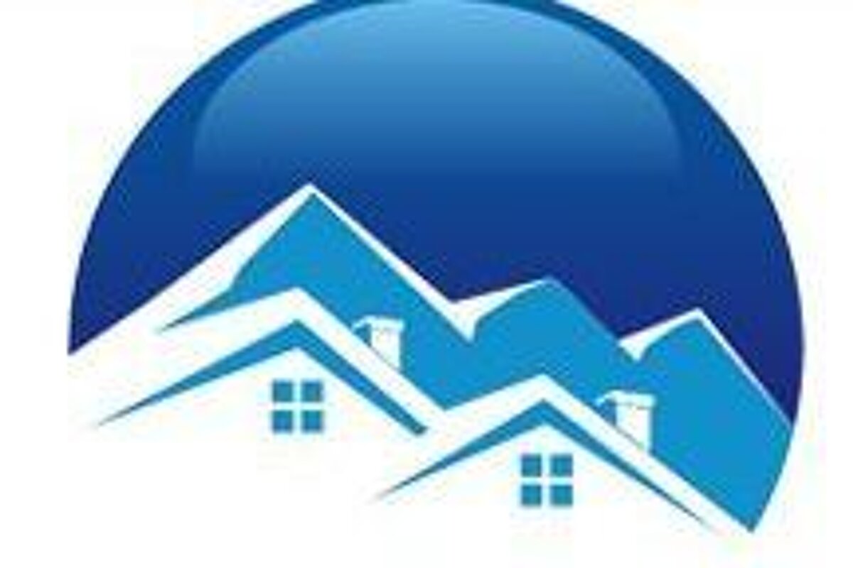 A logo of a mountain with houses on the roofs