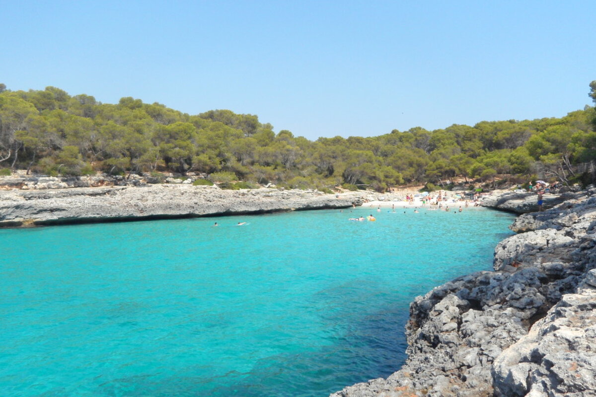 photo of small bay with ver blue water