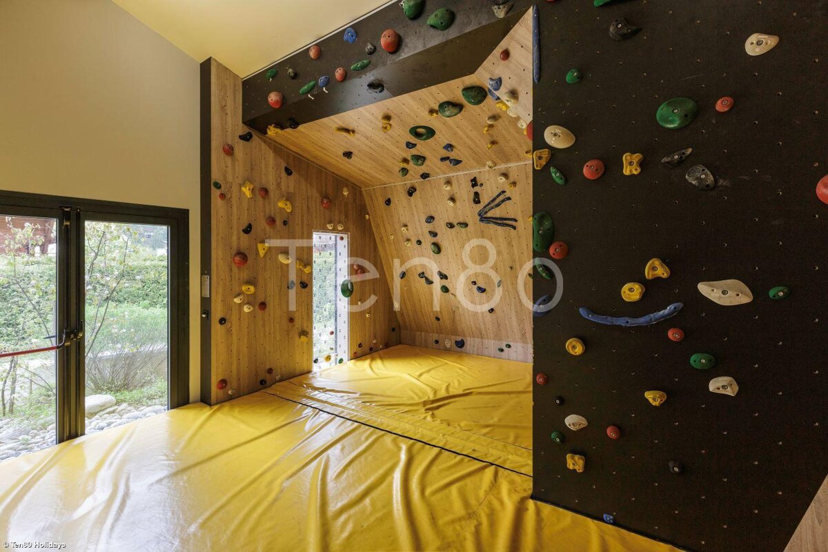A climbing wall with the number 80 on it