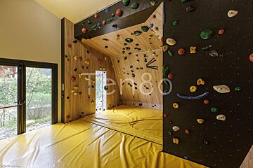 A climbing wall with the number 80 on it