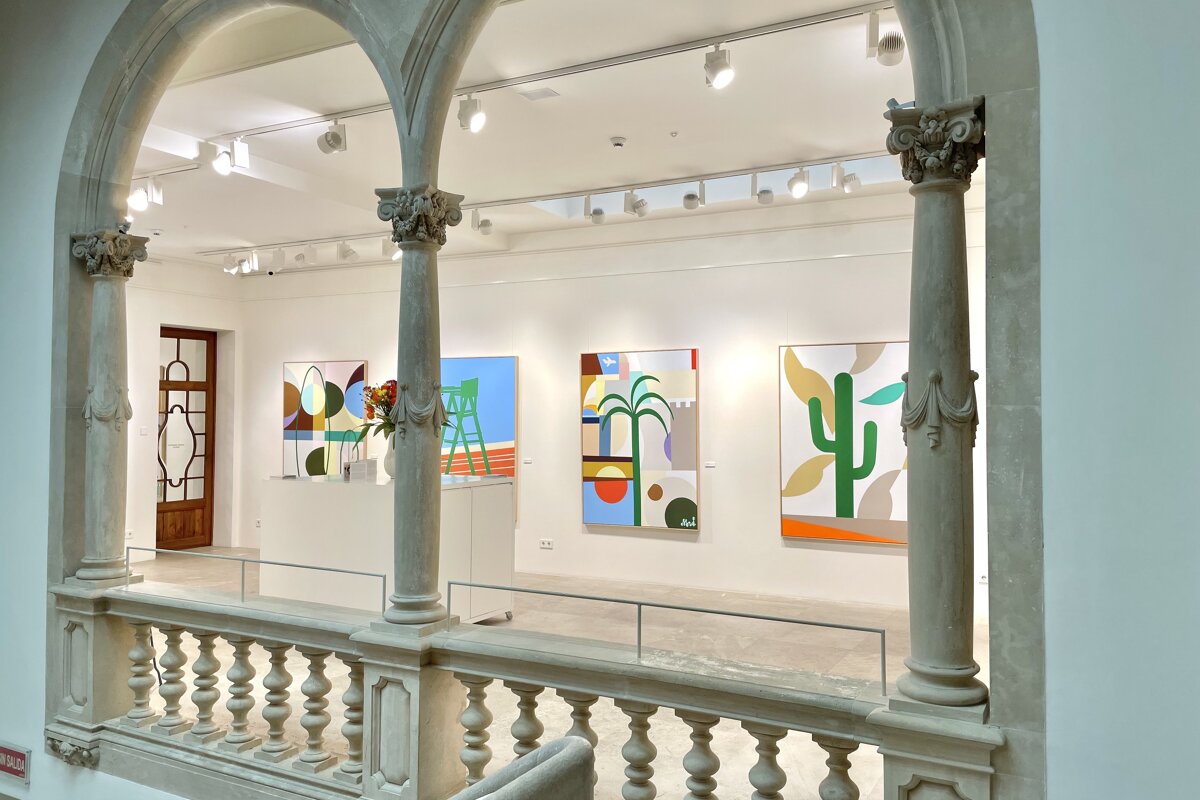 A painting of a cactus is on display in a museum