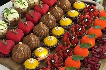 a plate of fancy desserts