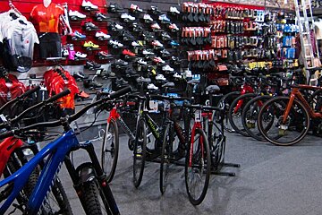 A row of specialized bikes are lined up in a store