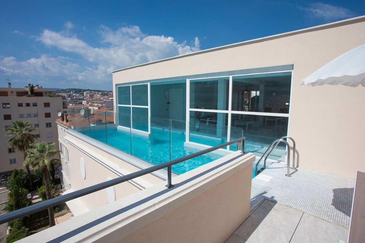 A large swimming pool on the roof of a building