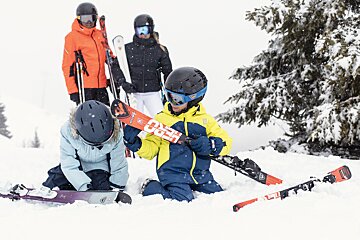A person wearing a helmet that says ' rossignol ' on it