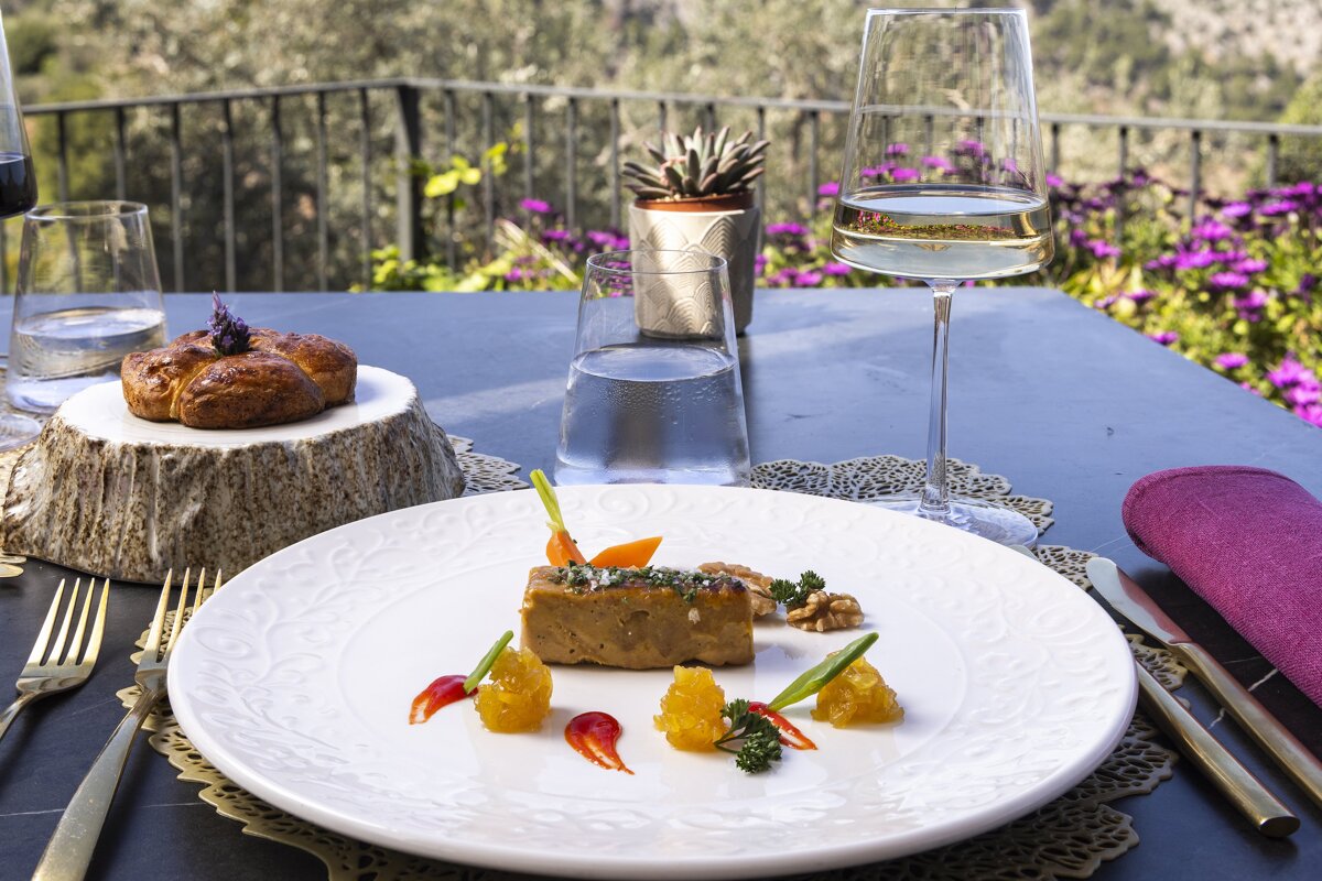 A plate of food and a glass of water on a table